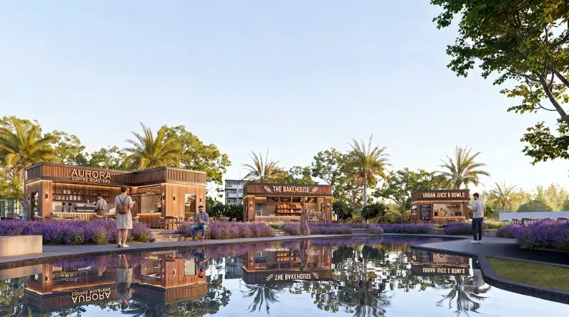 Food pavilions mirrored in a lake at dusk